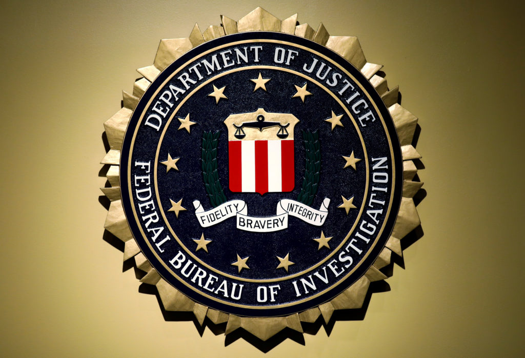 The Federal Bureau of Investigation seal is seen at FBI headquarters before a news conference by the FBI Director the inspector general's report in Washington
